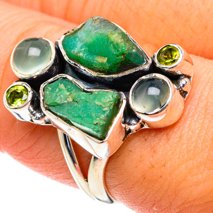 Silver ring with large rough green marquise stones and light blue round cabochons