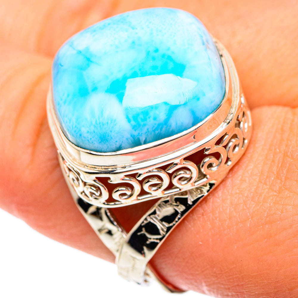 Larimar oval cabochon ring with silver cutout scrollwork band, bezel-set stone