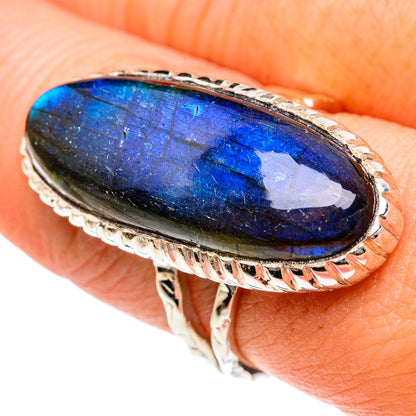 Oval labradorite ring with bright blue shimmer, silver bezel and textured side band