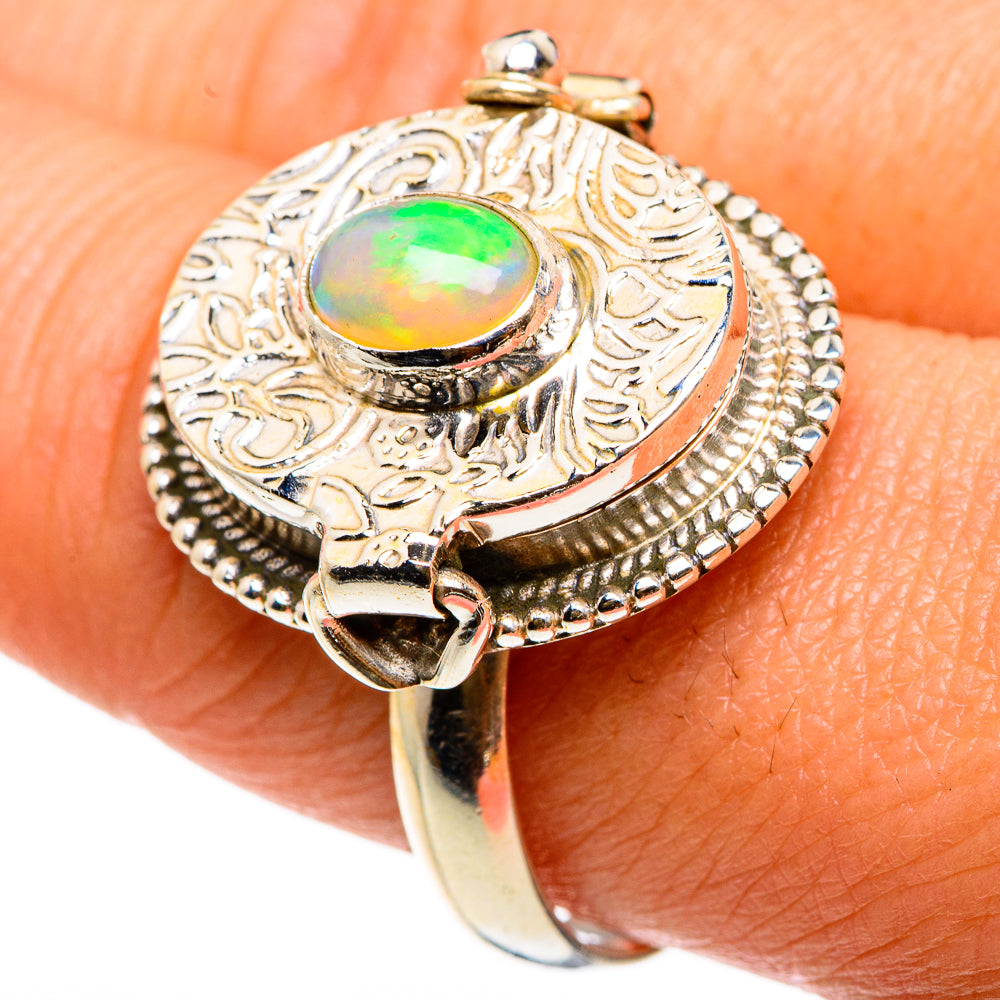 Sterling silver statement ring with oval opal center and ornate filigree bezel