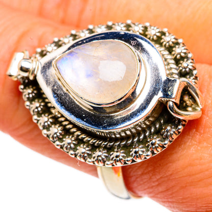 Sterling silver ring with oval iridescent moonstone and ornate beadwork bezel