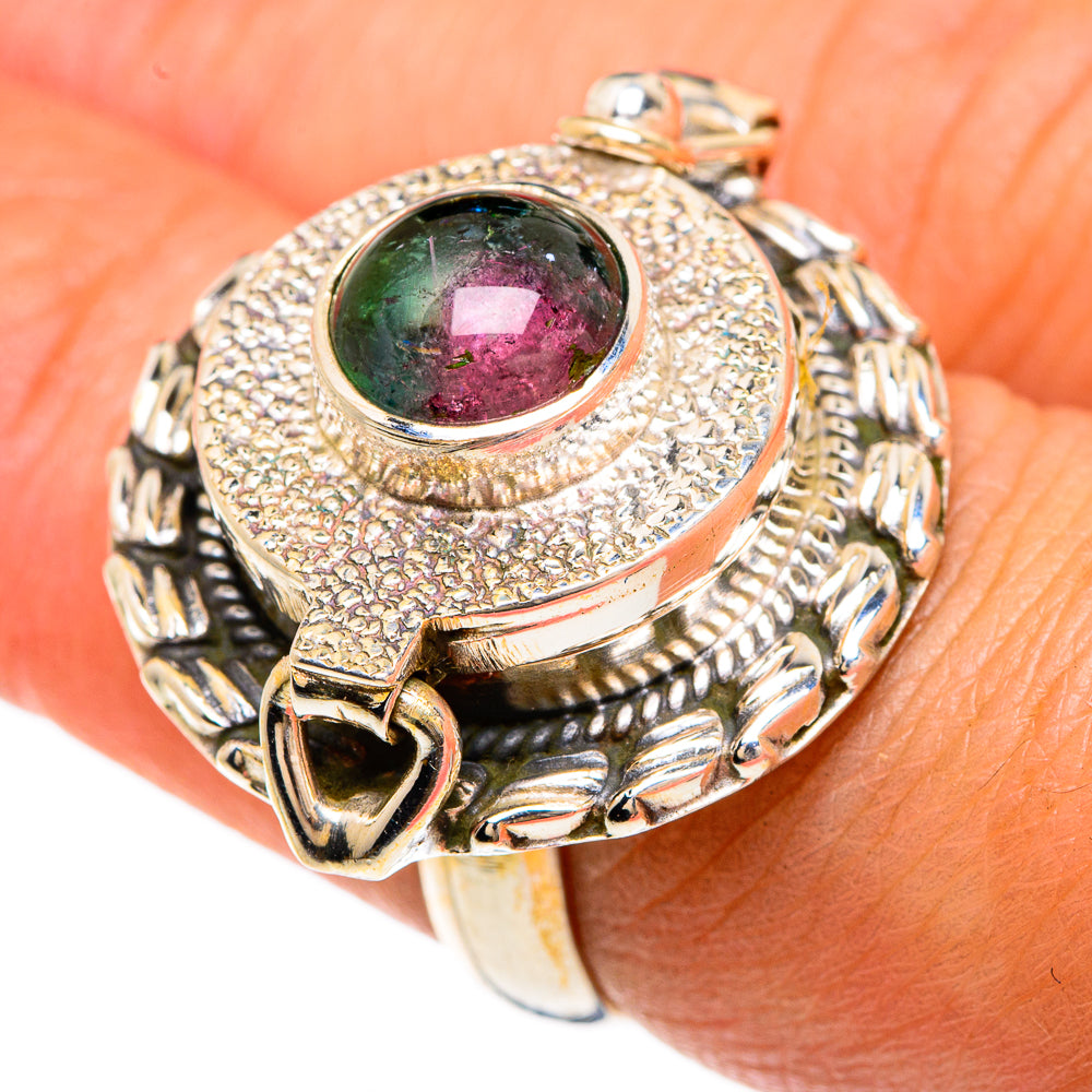 Poison-style ring with faceted multicolor gemstone center and textured silver-tone band