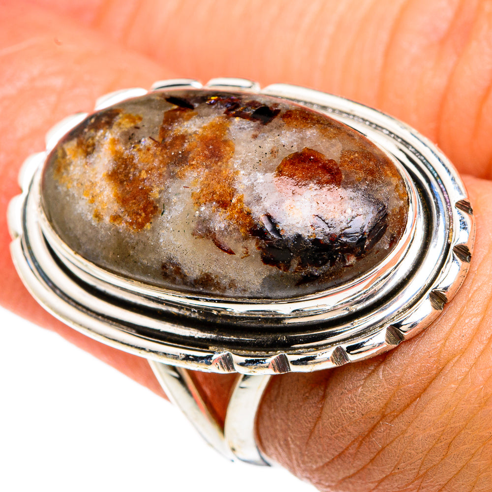 Russian eudialyte oval ring, sterling silver frame with orange-brown and gray marbled stone