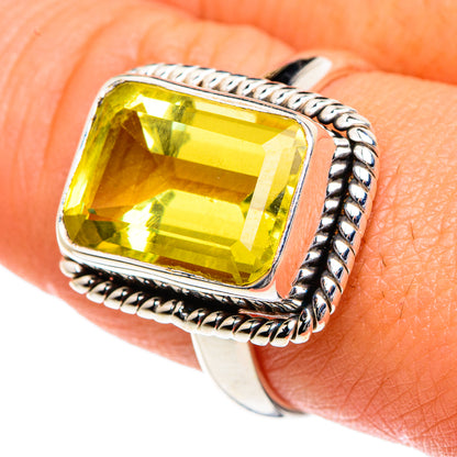 Close-up sterling silver ring with square cushion-cut yellow gemstone on beaded border