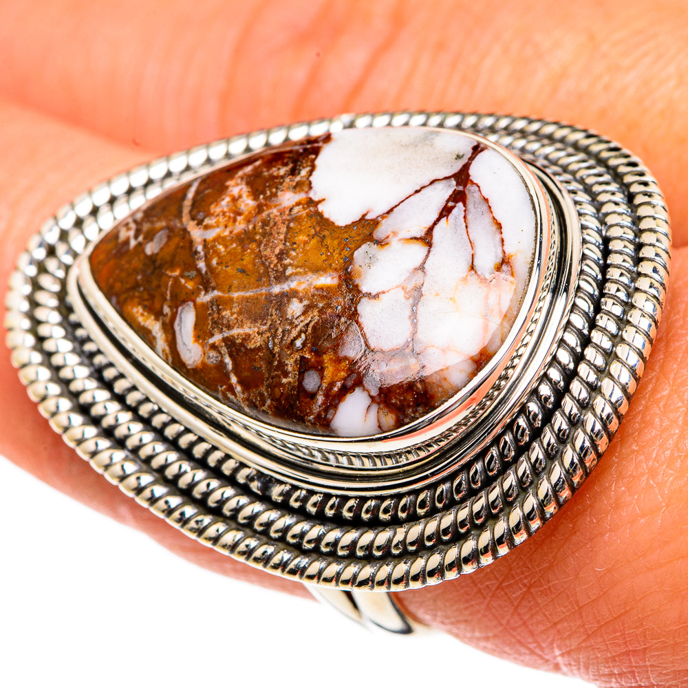 Sterling silver oval jasper ring close-up with brown and white stone, braided border