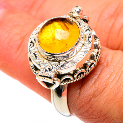 Sterling silver ring with oval yellow citrine, detailed bezel and raised side accents