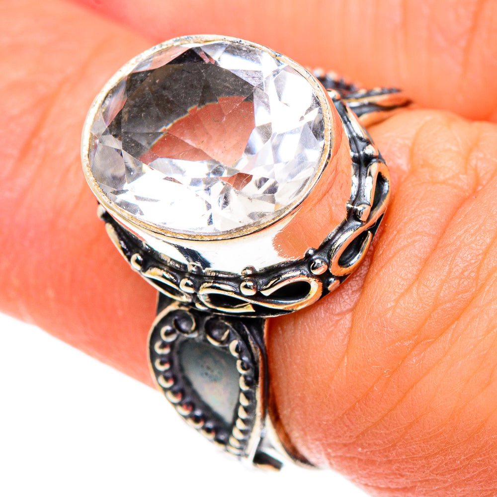 Silver round-cut quartz ring with ornate band and prong-set clear stone, size 6