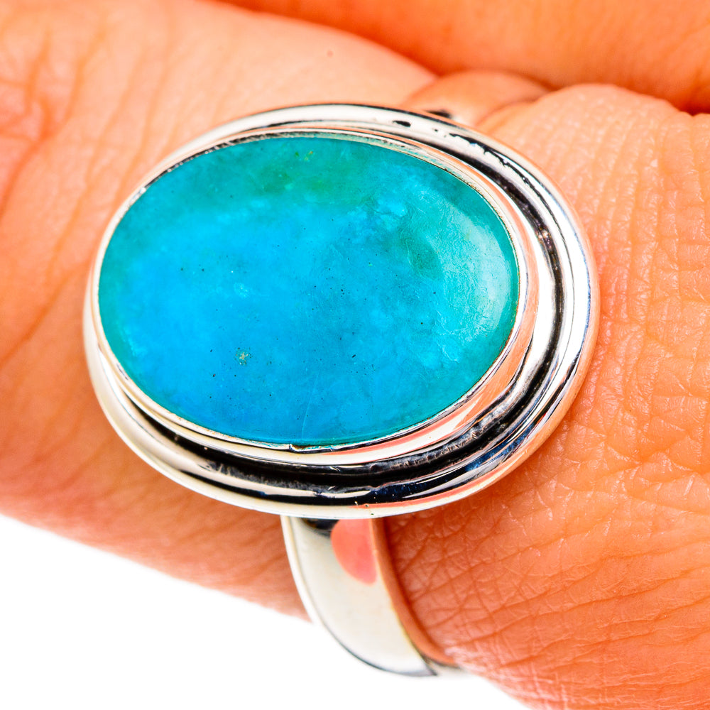 Oval turquoise opal gemstone ring with double silver bezel and textured edges