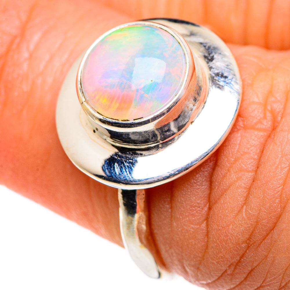 Oval opal ring in polished sterling silver; iridescent rainbow sheen on top