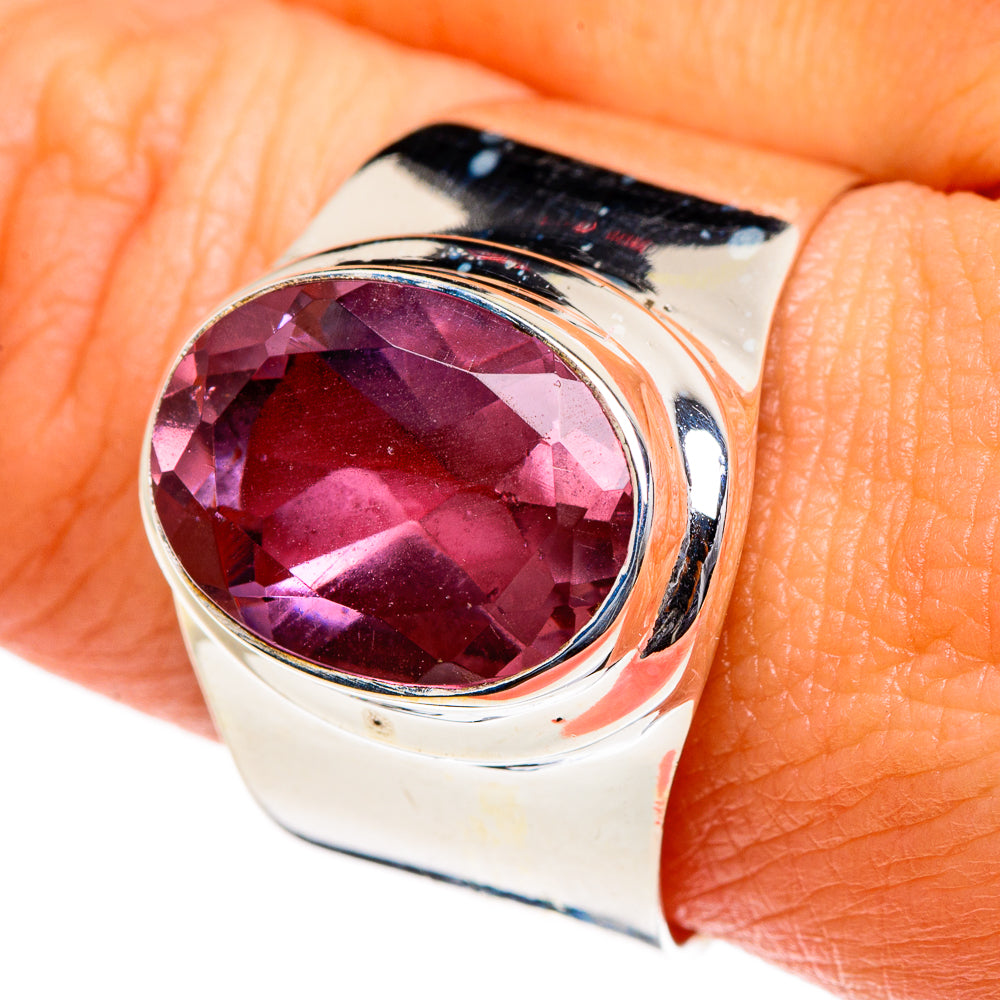 Sterling silver ring with oval purple color-change stone, polished bezel setting