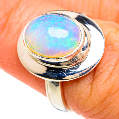 Opal cabochon ring with round bezel, polished silver-tone band