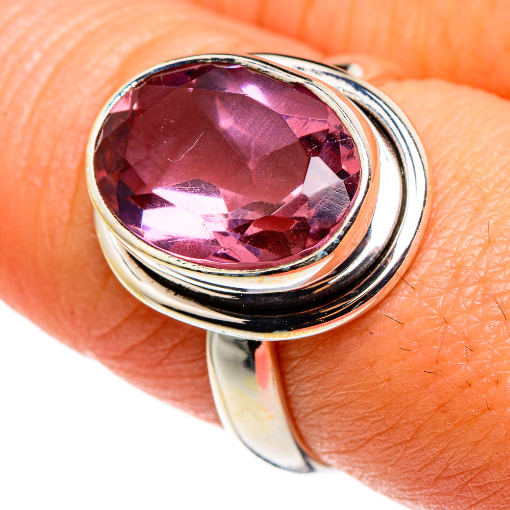 Sterling silver alexandrite-style ring with oval faceted pink gem, close-up