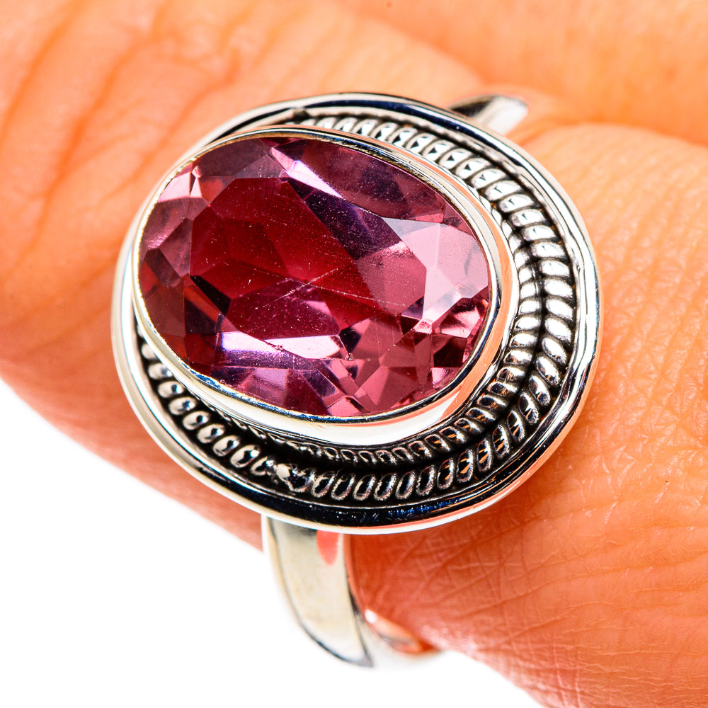 Sterling silver oval gemstone ring with purple faceted stone and engraved bezel
