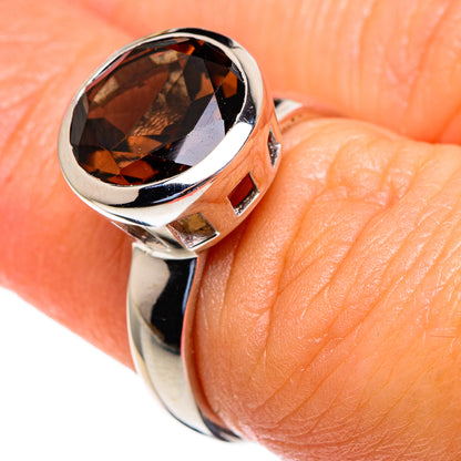 Sterling silver ring with dark smoky quartz oval in bezel, faceted gemstone detail