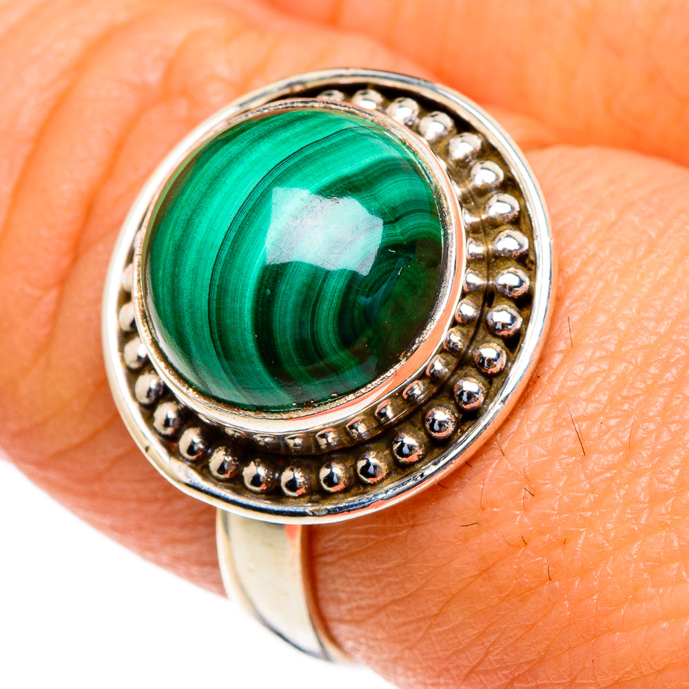 Sterling silver malachite oval ring with green cabochon and beaded halo detail