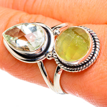 Sterling silver ring with one large oval green stone and a smaller oval beside it