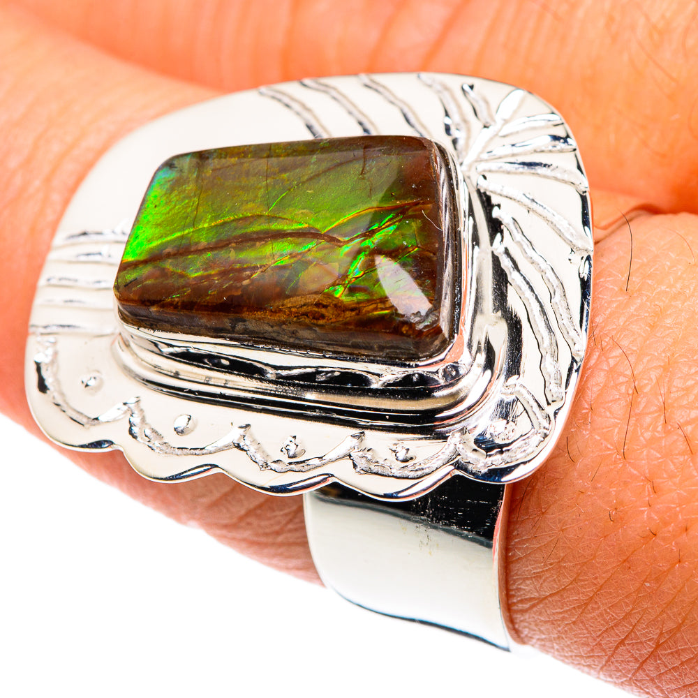 Silver ring with rectangular color-change stone, bright green to dark brown