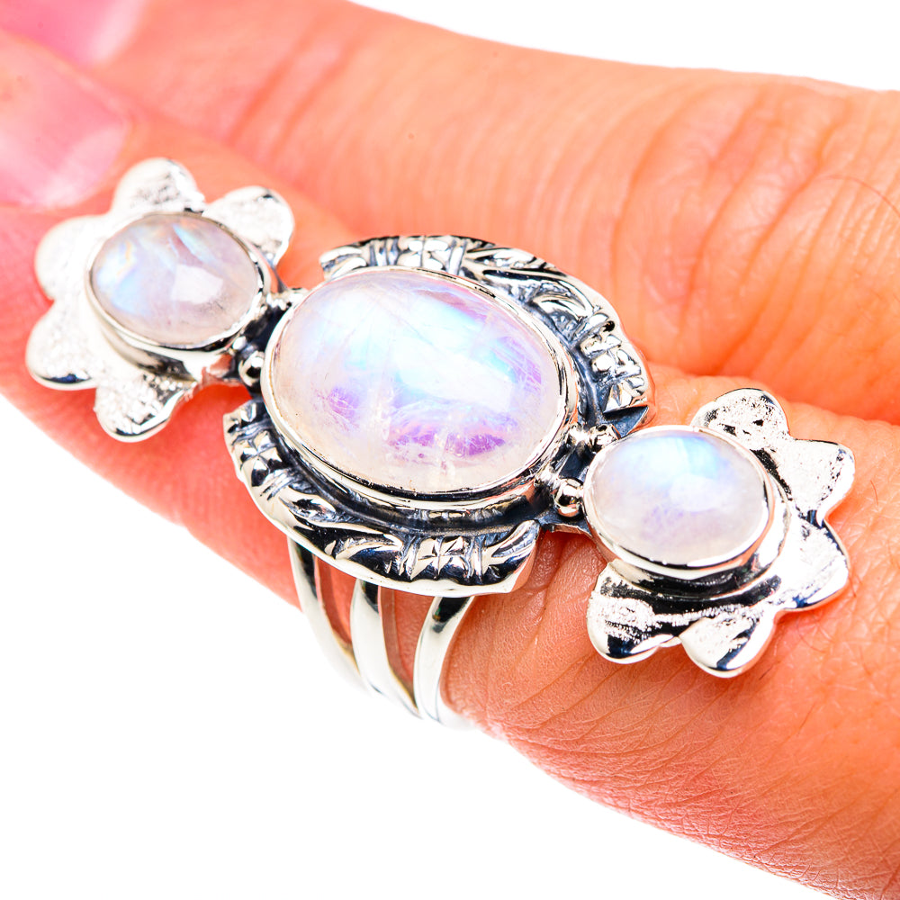 Sterling silver ring with three oval rainbow moonstones, ornate bezel settings