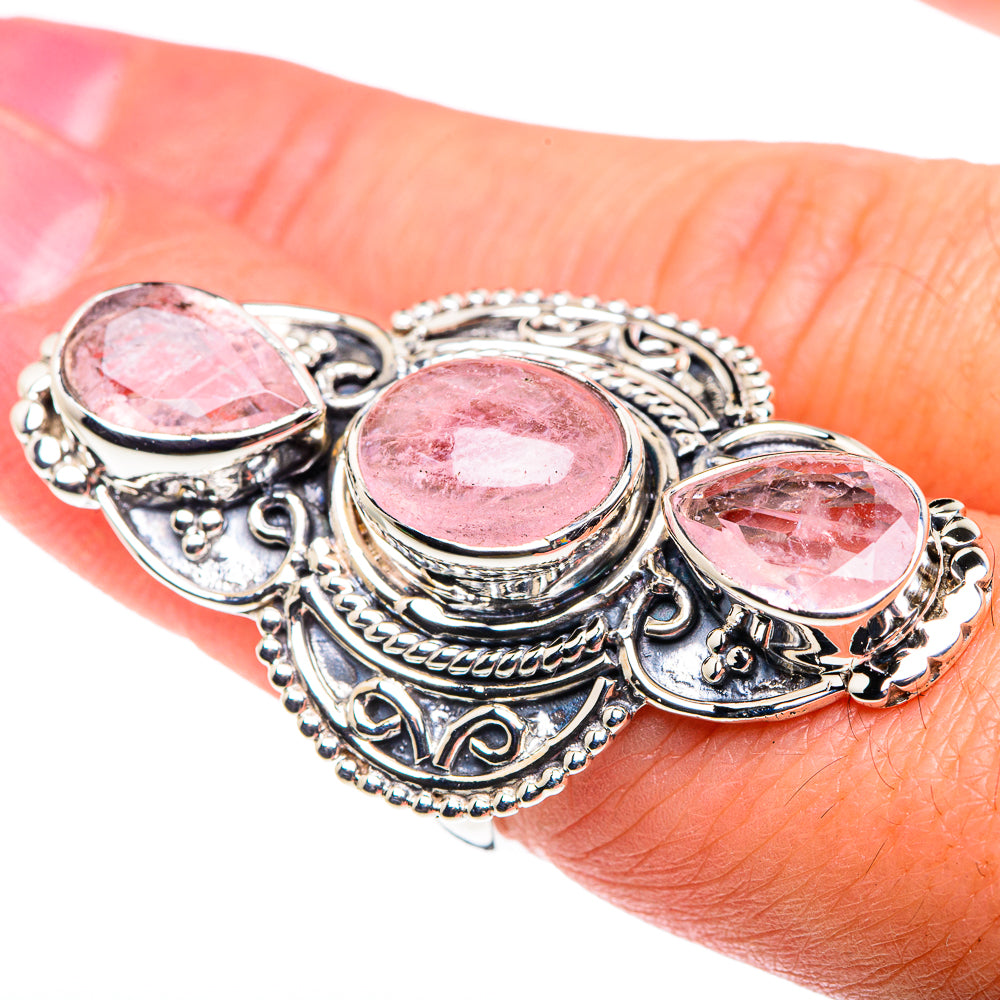 Silver-tone rose quartz ring with three oval pink stones on hand