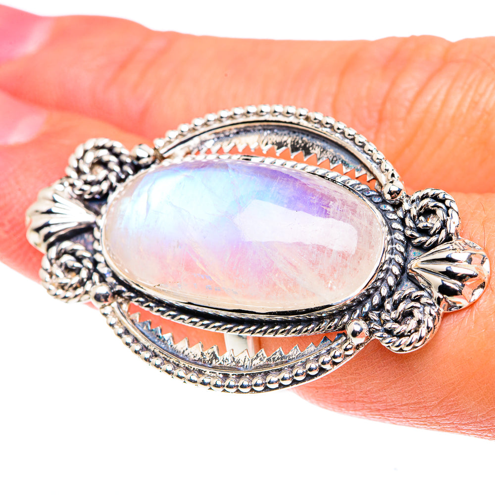Sterling silver ring with oval rainbow moonstone cabochon and ornate edges