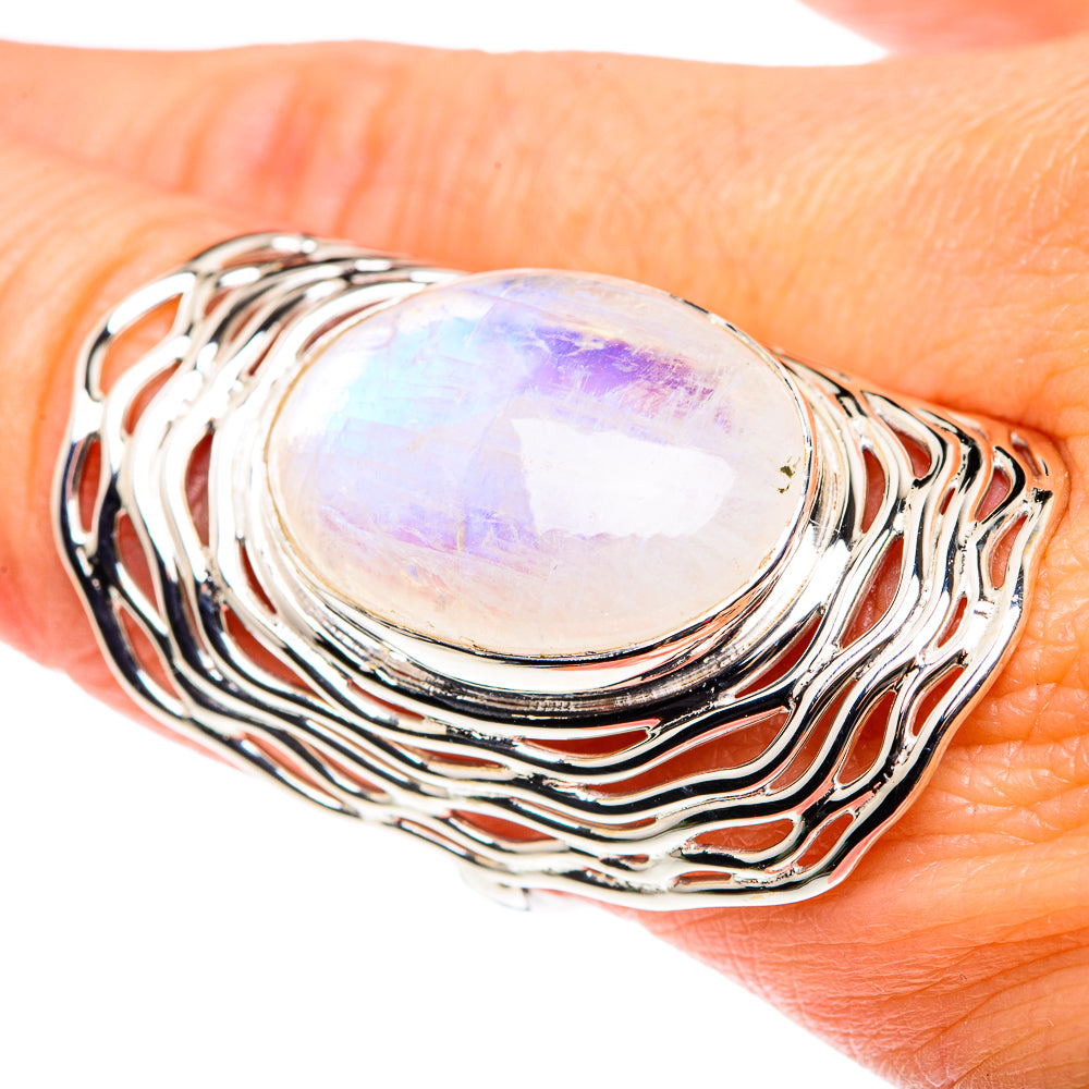 Sterling silver oval moonstone ring, wavy band; iridescent rainbow sheen