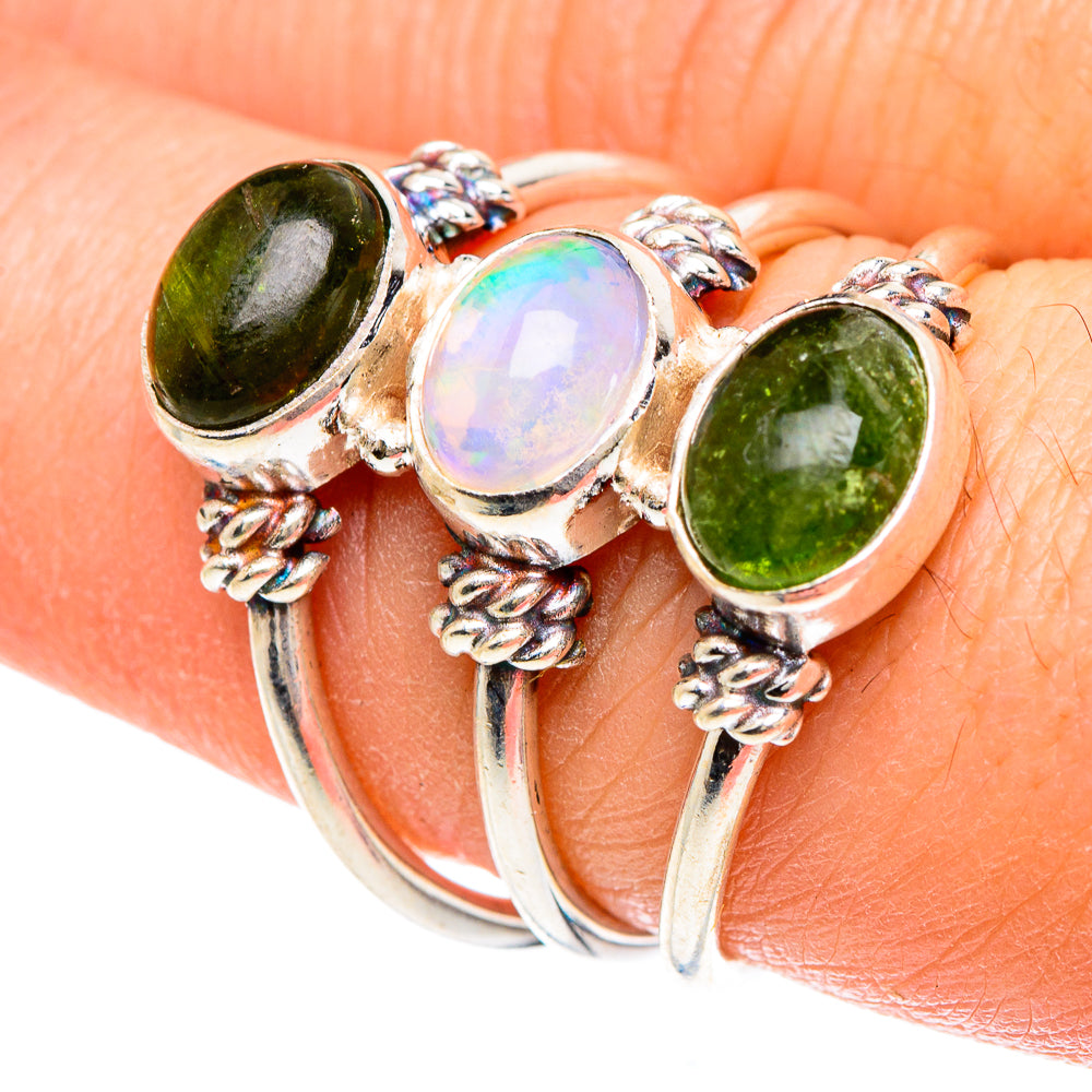 Three-stone opal and green gemstone ring in sterling silver, ornate side details