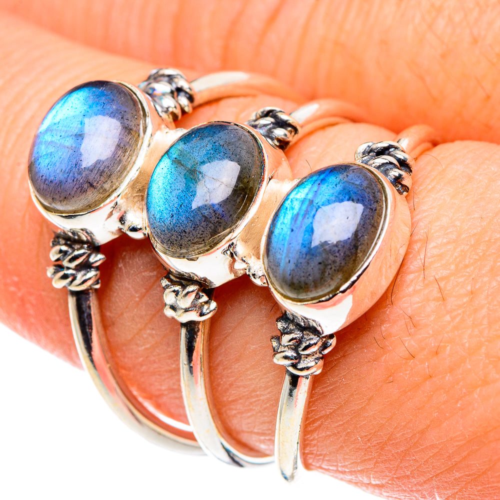 Sterling silver ring with three bezel-set oval labradorite stones in blue hues