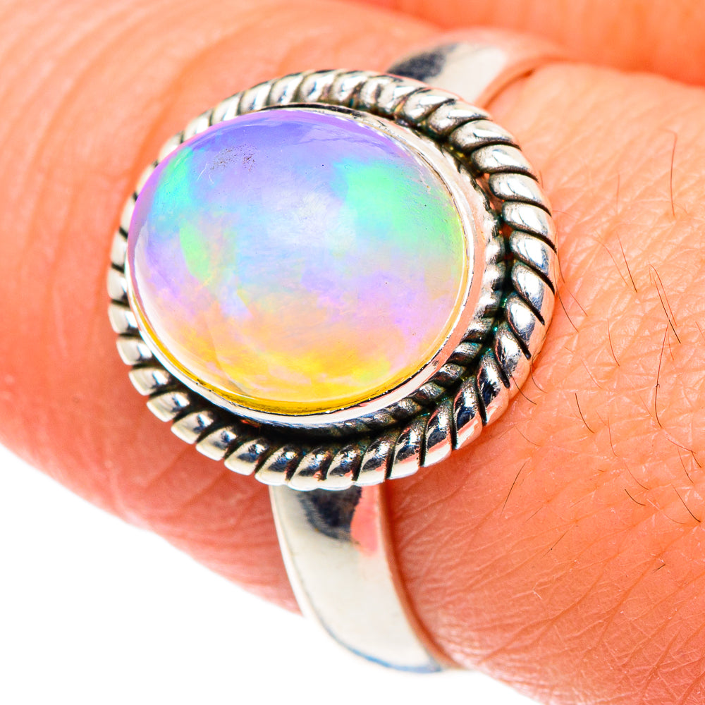 Round iridescent opal ring with detailed braided bezel, 925 sterling silver band