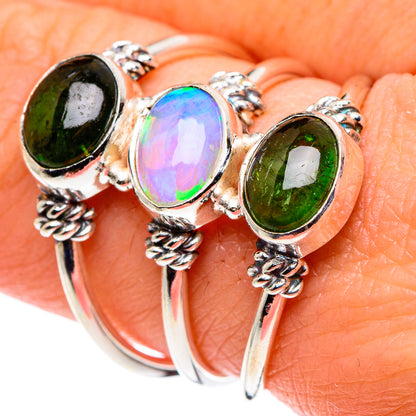 Sterling silver ring with oval green tourmaline, iridescent opal, and rope prongs