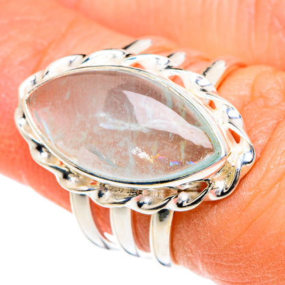 Oval aquamarine sterling silver ring with raised bezel and curved gallery, size 6