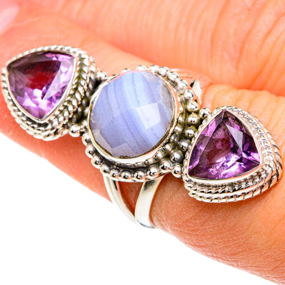 Sterling silver ring with oval blue center stone and two purple amethyst teardrops