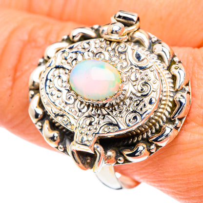 Sterling silver oval opal cabochon ring with engraved floral scrollwork, size 10.75