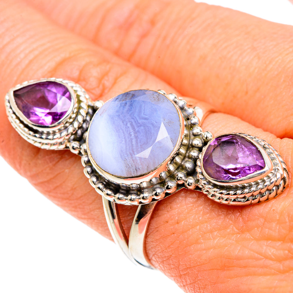 Sterling silver ring with pale blue oval cabochon and purple teardrop side stones