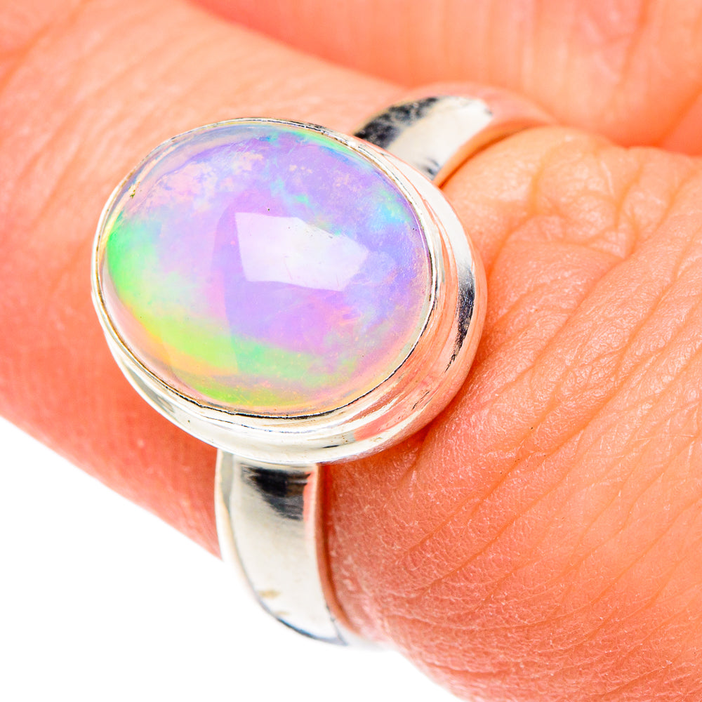Sterling silver opal ring close-up with rainbow round cabochon bezel setting