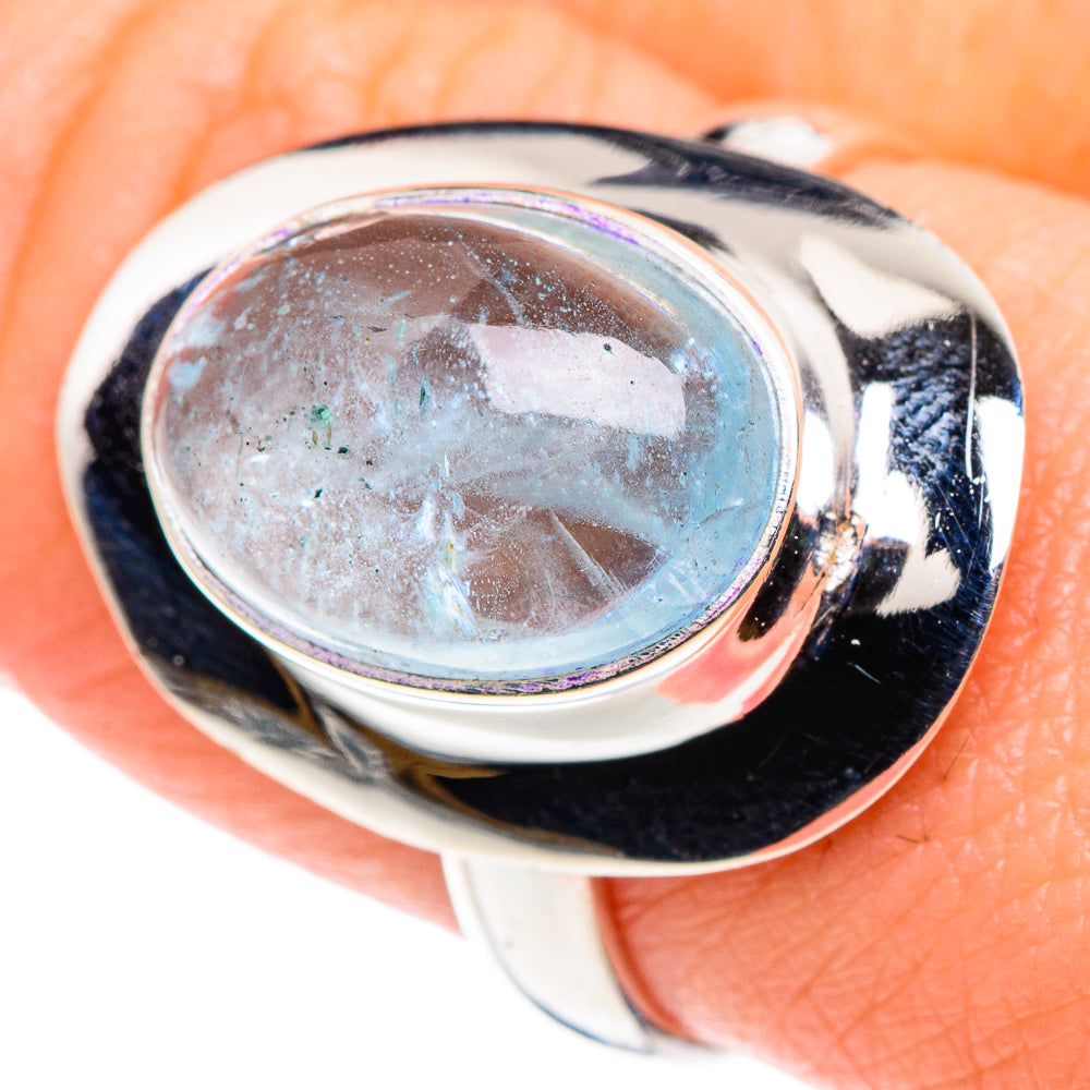 Close-up oval aquamarine in polished 925 sterling silver ring with glossy bezel