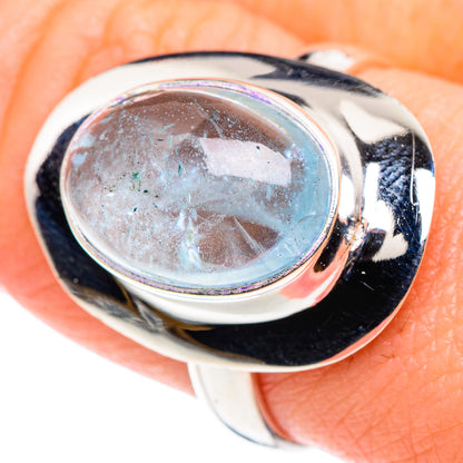 Close-up oval aquamarine in polished 925 sterling silver ring with glossy bezel