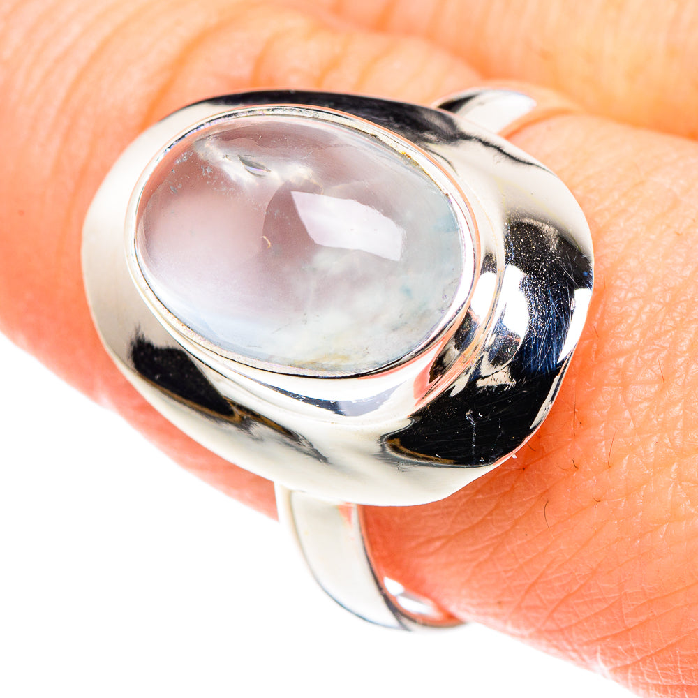 Oval natural aquamarine cabochon set in polished 925 sterling silver ring, close-up