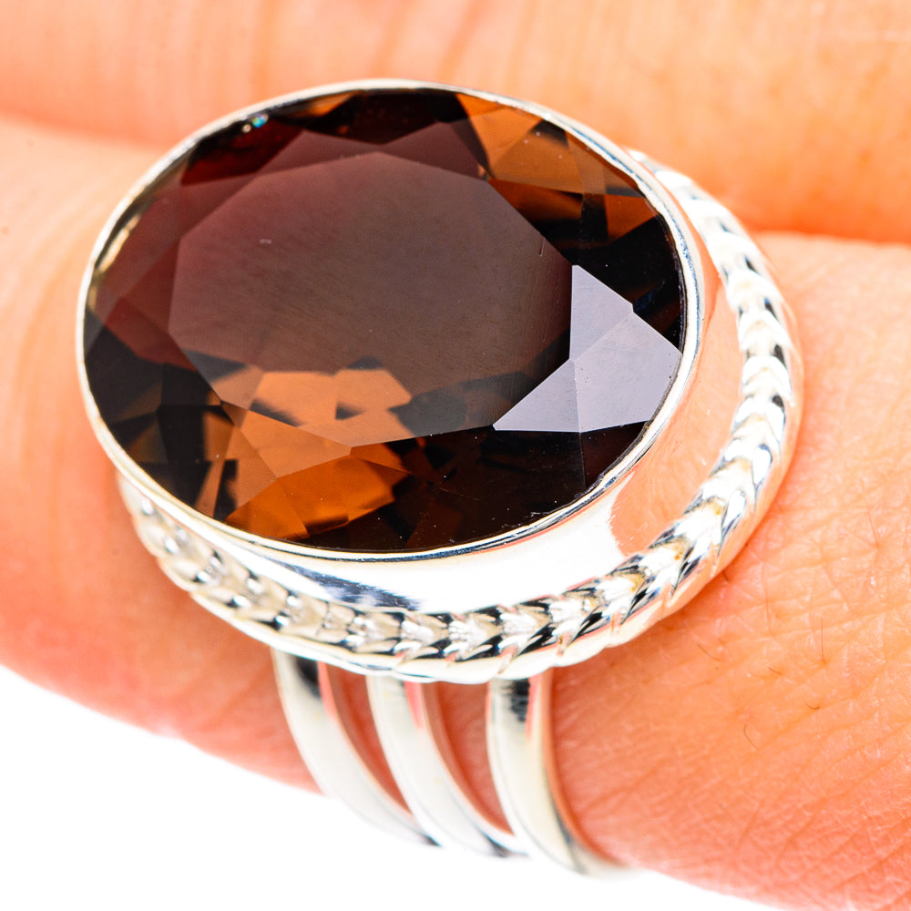 Silver oval smoky quartz ring with faceted dark gem and braided metal band