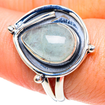 Teardrop aquamarine cabochon sterling silver ring, side prongs and oval halo