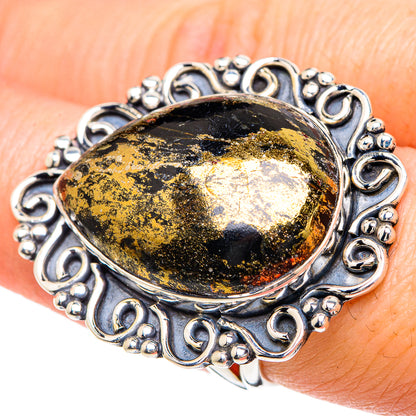 Oval black gemstone ring with gold pyrite flecks and ornate sterling silver setting, size 7.5
