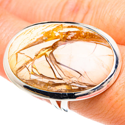 Sterling silver oval mookaite ring with amber, cream, and gold flecked stone bezel