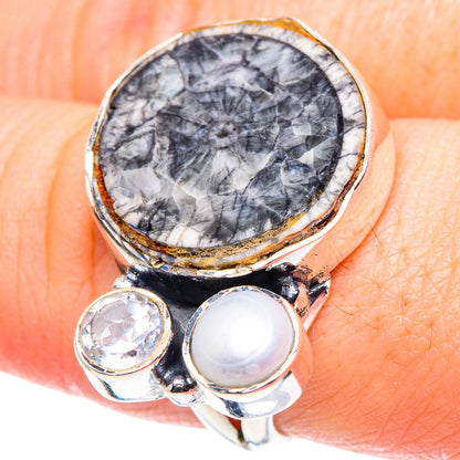 925 sterling silver ring with oval dark stone, white cultured pearl, and clear accent stones