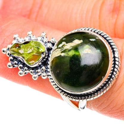Sterling silver ring with large oval green opal, textured bezel, and green teardrop stone