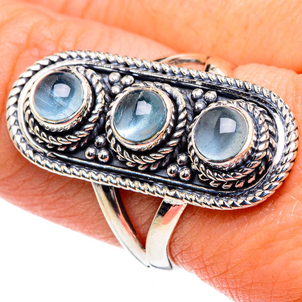 Sterling silver ring with three oval aquamarine-blue stones and ropework detailing