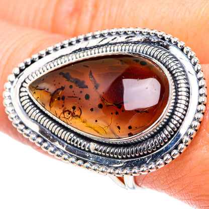 Montana agate ring with oval amber stone, ornate silver bezel and bead border