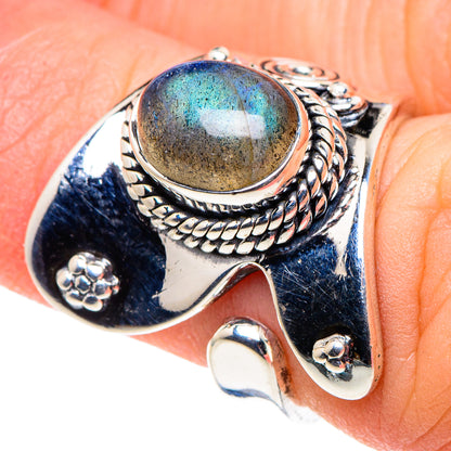 Sterling silver labradorite oval ring with braided bezel and side scroll details