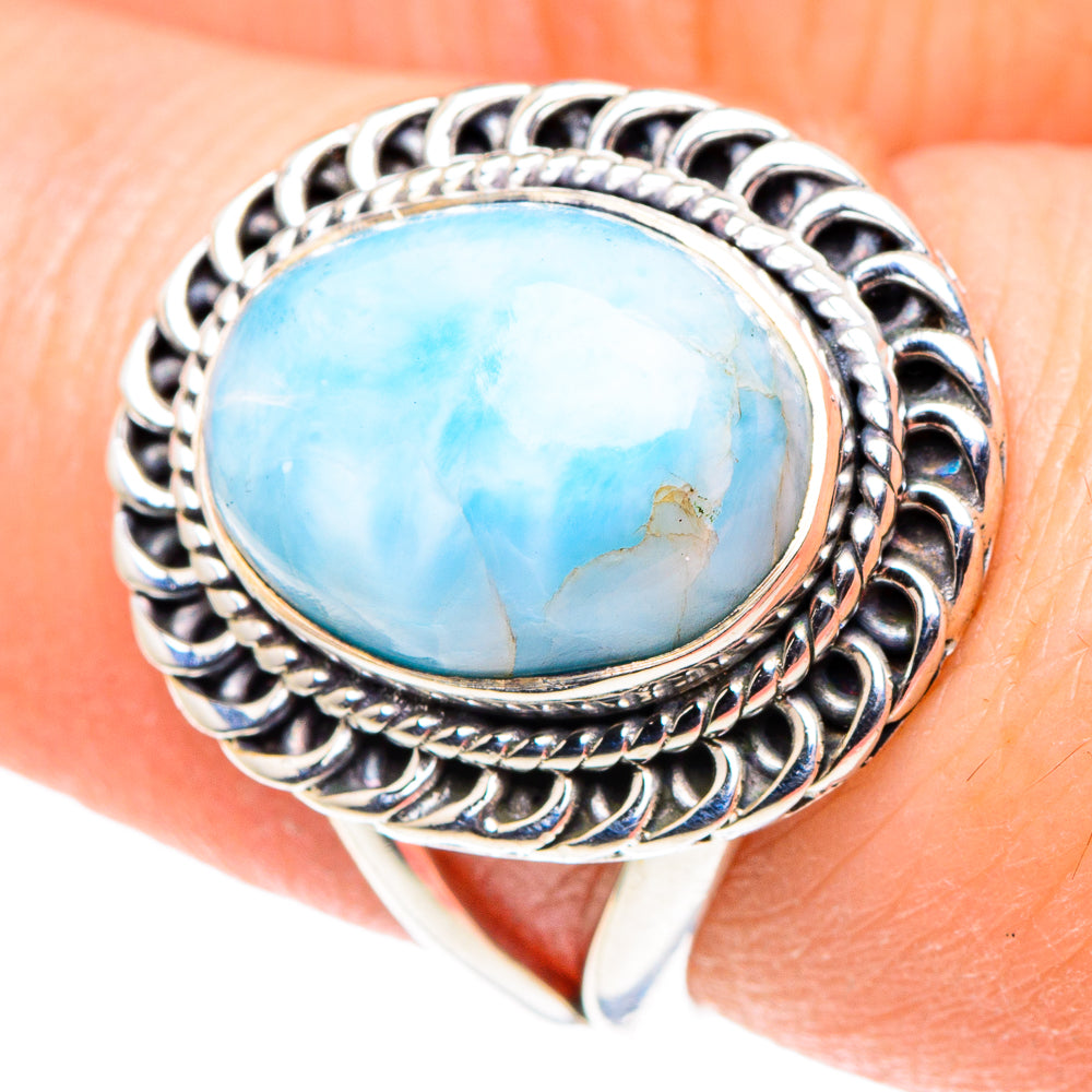 Oval blue larimar gemstone ring in ornate silver setting with twisted details