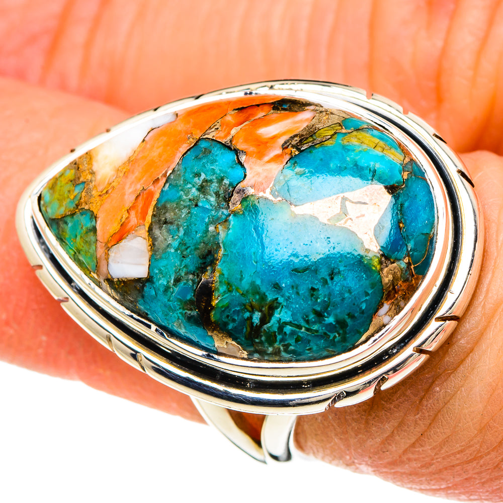 Oval turquoise composite ring in sterling silver bezel, showing orange copper and blue stone