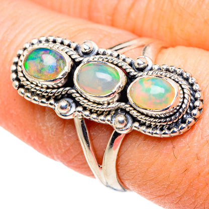 925 sterling silver opal ring with three oval Ethiopian opal stones and rope bezel