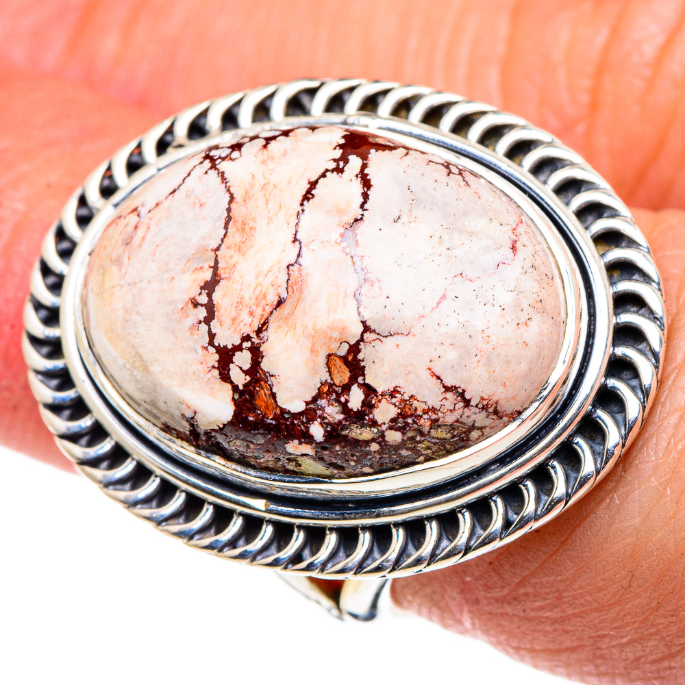 Sterling silver oval jasper ring with ornate ribbed frame on wrist